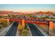 Aerial view of a modern pedestrian bridge over a roadway with mountain views at 8537 E Leland St, Mesa, AZ 85207