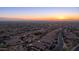 Aerial view of a luxury community at sunset, showcasing upscale homes and desert landscape at 8537 E Leland St, Mesa, AZ 85207