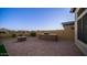 Outdoor kitchen, fire pit, and paved patio area at 8537 E Leland St, Mesa, AZ 85207