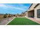 Artificial turf backyard with built-in BBQ and patio at 8537 E Leland St, Mesa, AZ 85207