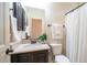 Clean bathroom with granite vanity, shower, and toilet at 8537 E Leland St, Mesa, AZ 85207