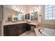 Elegant bathroom with double sinks and soaking tub at 8537 E Leland St, Mesa, AZ 85207