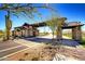 Gated community entrance with stone pillars and Spanish-style architecture at 8537 E Leland St, Mesa, AZ 85207