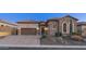 Stunning stone elevation, 2-car garage, & landscaped yard at 8537 E Leland St, Mesa, AZ 85207