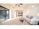 Living room with sliding doors to the patio and views to kitchen at 8537 E Leland St, Mesa, AZ 85207