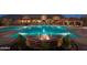 Community swimming pool with fountain and stunning mountain views at night at 8537 E Leland St, Mesa, AZ 85207