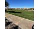 Neatly landscaped community park with a walking path at 9814 E Palladium Dr, Mesa, AZ 85212