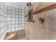 Bathroom with a walk-in shower and glass block feature wall at 10040 E Grandview St, Mesa, AZ 85207