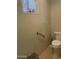 Small bathroom with toilet and grab bar at 10040 E Grandview St, Mesa, AZ 85207