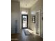 Bright and airy entryway with tile flooring and a view of the front door at 10040 E Grandview St, Mesa, AZ 85207