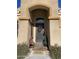 Ornate front door with decorative accents and a festive Christmas wreath at 10040 E Grandview St, Mesa, AZ 85207