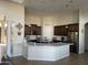 Spacious kitchen boasts a large island, ample cabinetry, and stainless steel appliances at 10040 E Grandview St, Mesa, AZ 85207