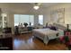 Main bedroom with hardwood floors and large windows at 10040 E Grandview St, Mesa, AZ 85207