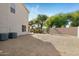 Large gravel backyard with mature trees and a home at 1021 E Mead Dr, Chandler, AZ 85249