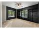 Bedroom with built-in shelving and ceiling fan at 1021 E Mead Dr, Chandler, AZ 85249