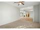 Open living room with carpet flooring and a view into the kitchen at 1021 E Mead Dr, Chandler, AZ 85249