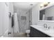 Updated bathroom with gray marble tile, a shower/tub combo, and modern vanity at 1320 W Palo Verde Dr, Chandler, AZ 85224