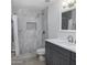 Updated bathroom with gray marble tile, a shower/tub combo, and modern vanity at 1320 W Palo Verde Dr, Chandler, AZ 85224