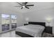 Bright bedroom with king-size bed and access to a patio at 1320 W Palo Verde Dr, Chandler, AZ 85224