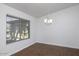 Simple dining room with hardwood floors and large window at 1320 W Palo Verde Dr, Chandler, AZ 85224