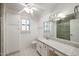 A well-lit bathroom featuring a vanity with a granite countertop at 13359 W Ballad Dr, Sun City West, AZ 85375