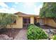 Charming front entrance with a brick walkway, desert landscaping, and a secure gate at 13359 W Ballad Dr, Sun City West, AZ 85375