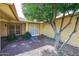 Charming front yard with a tree providing shade near the entrance of the house at 13359 W Ballad Dr, Sun City West, AZ 85375