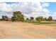 Beautiful golf course with rolling hills and mature trees, perfect for golf enthusiasts at 13359 W Ballad Dr, Sun City West, AZ 85375