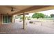 Covered patio features a ceiling fan and views of the meticulously maintained golf course at 13359 W Ballad Dr, Sun City West, AZ 85375