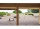 Inviting covered patio with brick pavers overlooking a lush green golf course at 13359 W Ballad Dr, Sun City West, AZ 85375