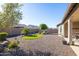 Backyard with gravel, artificial turf, and landscaping at 16807 W Berkeley Rd, Goodyear, AZ 85395