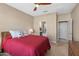 Bedroom with ceiling fan and en-suite bathroom at 16807 W Berkeley Rd, Goodyear, AZ 85395