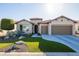 Stunning curb appeal with xeriscape landscaping and a two-car garage at 16807 W Berkeley Rd, Goodyear, AZ 85395