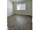 Bedroom featuring wood floors and a large window at 1770 E Sandra Ter, Phoenix, AZ 85022
