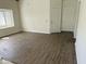 Bright living room with wood floors, lots of light from the window, and two entry doors at 1770 E Sandra Ter, Phoenix, AZ 85022