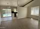 Light filled open-concept living room featuring wood floors, a kitchen and a view of the outdoor pool at 1770 E Sandra Ter, Phoenix, AZ 85022