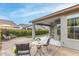 Relaxing backyard with patio, seating area, and lush landscaping at 20385 W Vista Paseo Dr, Buckeye, AZ 85396