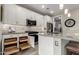 White kitchen with pull out drawers, and stainless steel appliances at 20385 W Vista Paseo Dr, Buckeye, AZ 85396