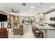 Open concept kitchen with island, stainless steel appliances, and white cabinetry at 20385 W Vista Paseo Dr, Buckeye, AZ 85396