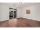 Bright bedroom with hardwood floors and sliding glass door to patio at 2133 E La Salle St, Phoenix, AZ 85040