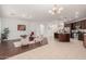 Spacious kitchen with an island and dark wood cabinets, open to living area at 2133 E La Salle St, Phoenix, AZ 85040