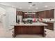 Large kitchen island with granite countertop, perfect for casual dining at 2133 E La Salle St, Phoenix, AZ 85040