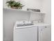 Laundry room with washer, dryer and shelving at 2133 E La Salle St, Phoenix, AZ 85040