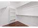 Large walk-in closet with shelves and hanging rods at 2133 E La Salle St, Phoenix, AZ 85040