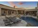 Luxury backyard with a pool, spa, fire pit, and outdoor kitchen at 26872 N 102Nd St, Scottsdale, AZ 85262