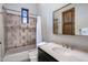 Bathroom with shower/tub combo and stone vanity at 26872 N 102Nd St, Scottsdale, AZ 85262