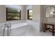 Elegant bathroom with soaking tub, tile shower, and modern fixtures at 26872 N 102Nd St, Scottsdale, AZ 85262