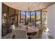 Round dining table with seating for six, overlooking the pool and mountains at 26872 N 102Nd St, Scottsdale, AZ 85262