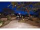 Landscaped walkway leading to a beautiful home at night at 26872 N 102Nd St, Scottsdale, AZ 85262