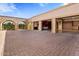 Exterior view of the three-car garage with brick pavers at 26872 N 102Nd St, Scottsdale, AZ 85262